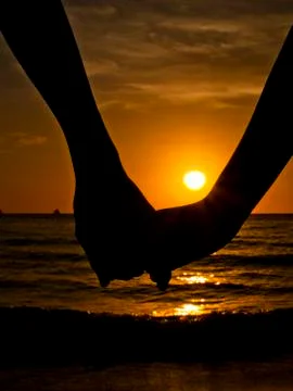 Holding Hands at the Beach Stock Photos