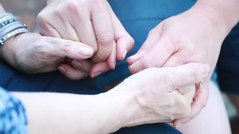 Holding hands in comfort Stock Footage 239298796