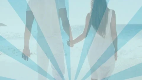 Holding hands, couple at beach with animation of blue rays pattern Stock Footage 304014530
