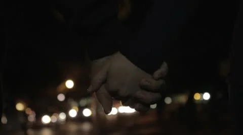 Holding Hands Downtown at Night Stock Footage 10772658