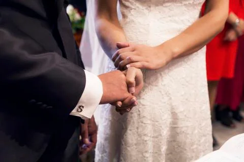 Holding hands during the wedding Stock Photos