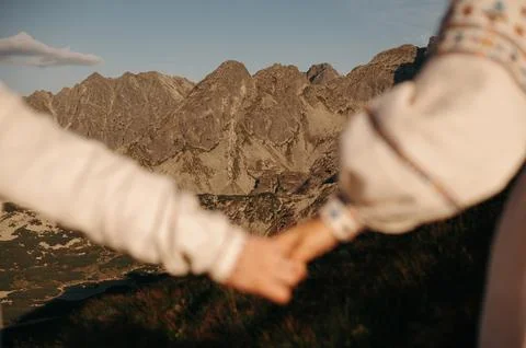 Holding Hands with Mountain View Stock Photos