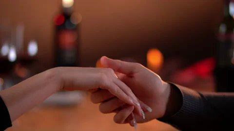 Holding hands with romantic background Stock-Footage 63377618