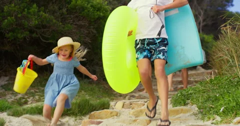 Holding hands, running and steps with family at beach together for holiday Stock Footage 307698545