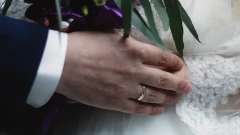 A holding hands together close up of just married couple Stock Footage 124960650