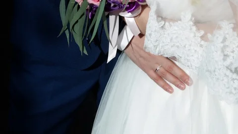 A holding hands together close up of just married couple Stock Footage 124960667