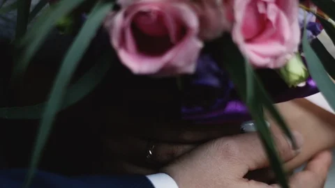 A holding hands together close up of just married couple Stock Footage 124960725