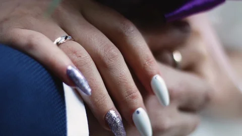 A holding hands together close up of just married couple Stock Footage 124960764