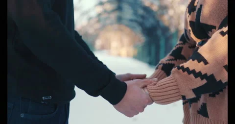 Holding hands in winter time Stock Footage