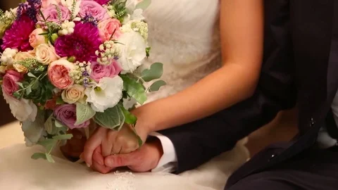 Holding hands of a young couple during wedding ceremony. Stock Footage 74177162