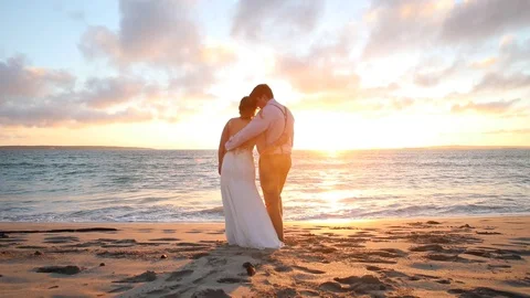 Holding His Bride By The Ocean At Sunset Stock-Footage 115325878