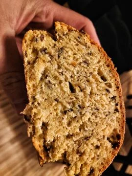 Holding Homemade Bread in Hands 库存照片