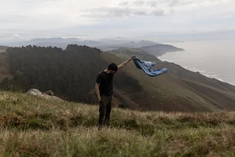 Holding jacket in nature Stock Photos