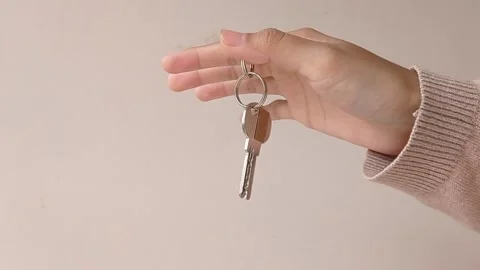 Holding a key and make it moving Stock Footage 150397847