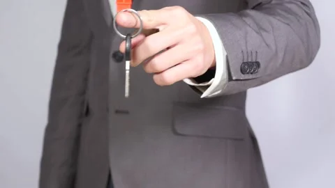 Holding key from house Stock Footage 236285615