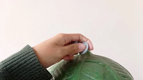 Holding a leaf-shaped ceramic with white background Stock Footage 145463334