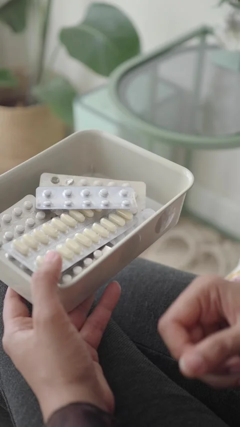 Holding medication in a container at home Stock Footage 340543631