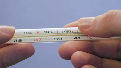 Holding The Mercury Thermometer Stock Footage 126919920