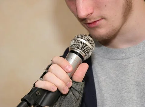 Holding Microphone Stock Photos