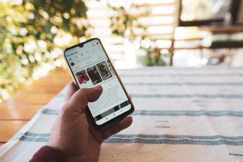 Holding a mobile phone with several applications Stock Photos