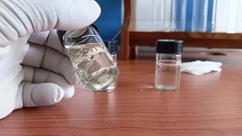Holding Up Mosquito Larvae Sample Cell To Camera 動画素材 335473246