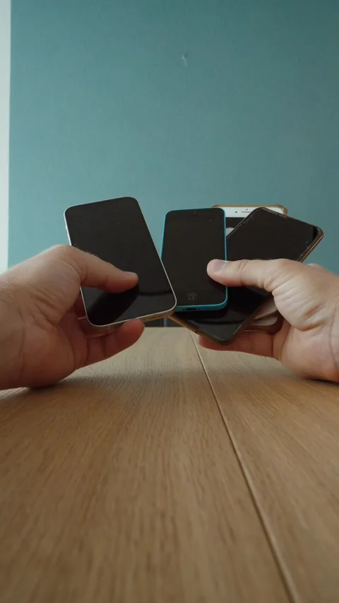Holding Multiple Old Smartphones for Electronic Recycling Stock Footage 344464009