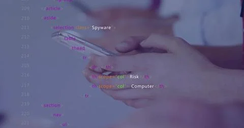 Holding pair of hands tapping smartphone at desk, with code overlay and Stock Photos