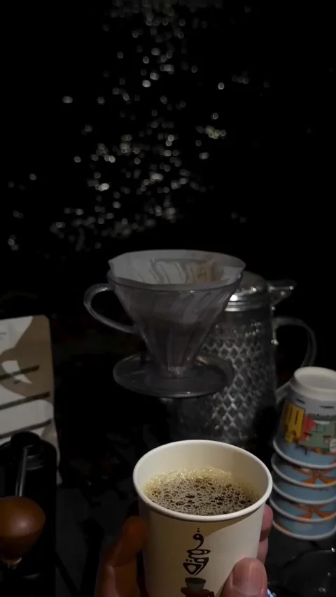 Holding Paper Cup of Coffee at Night Outdoors 库存影片 342267585