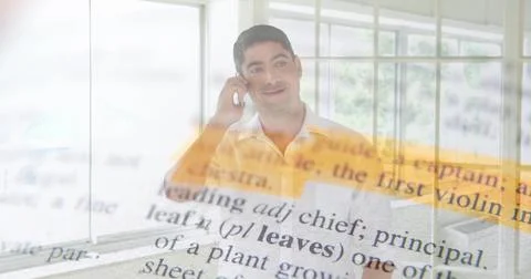 Holding phone to ear, man in collared shirt in office by windows, dictionary Stock Photos