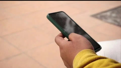 Holding phone Stock Footage 195977317