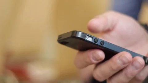 Holding the phone in hand Stock Footage 74676319