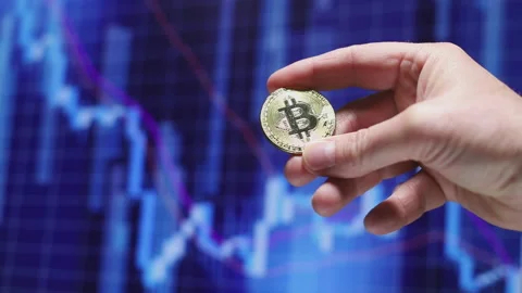 Holding the physical Bitcoin Stock Footage 180594387