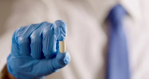 Holding pill camera is sliding Video stock 320094496