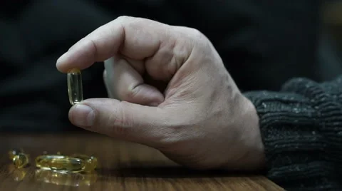 Holding a pill Stock Footage 58951062