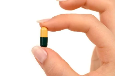 Holding a pill Stock Photos