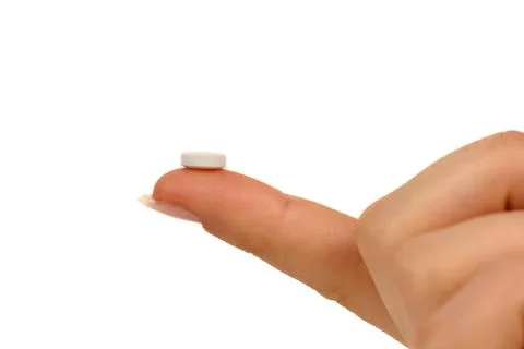 Holding a pill Stock Photos