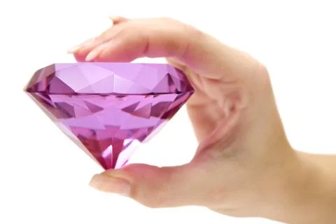 Holding a Pink Gemstone Isolated on a White Background Foto stock