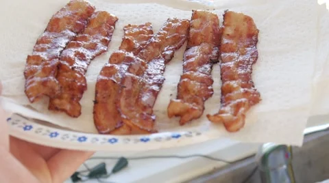 Holding plate of bacon strips Stock Footage 68655822