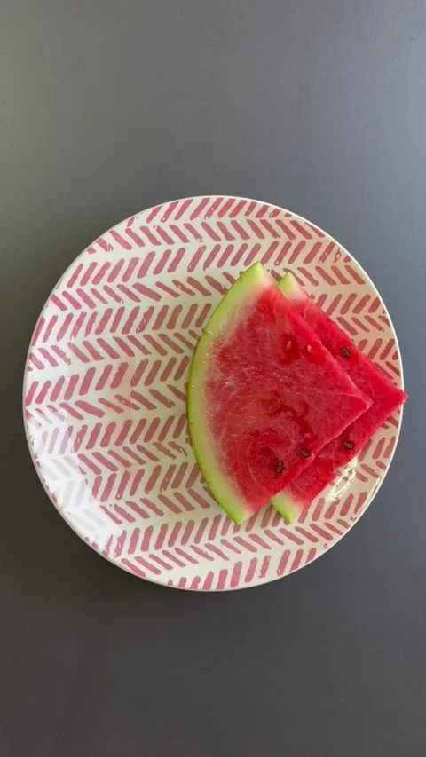 Holding a plate of watermelon Stock Footage 343543972