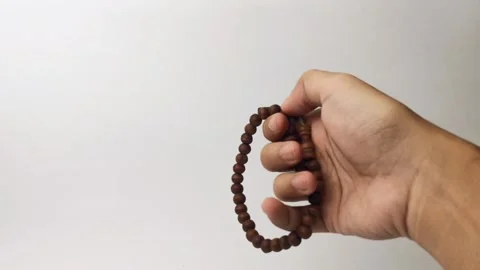 Holding prayer beads Stock Footage 312902674