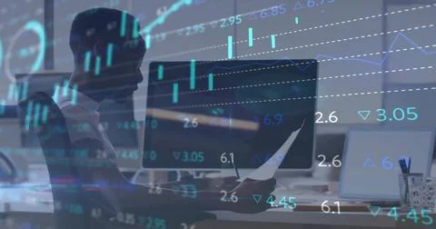 Holding printed report analyst analyzing financial data at office, with dual Stock Photos