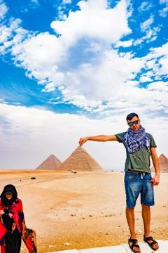 Holding the pyramid in Cairo, Egypt Stock Photos