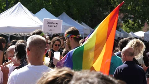 Holding rainbow flag in lgbt parade 4k Stock Footage 138223053