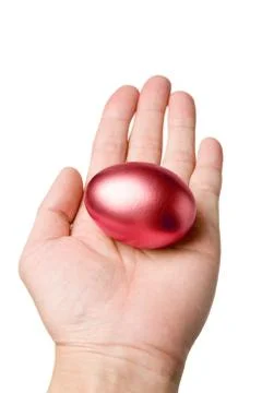 Holding a red egg Stock Photos