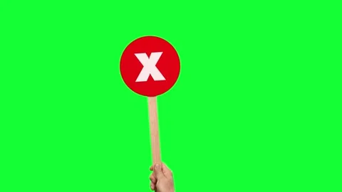 Holding a Red X Wrong Paddle Green Screen Stock Footage 303662822