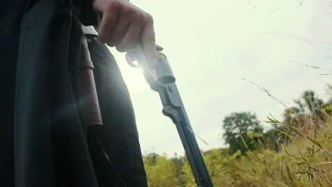 Holding revolver at side Stock Footage 152182474