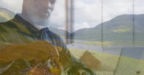 Holding round object, man reflected in dark polo gazing through window frame Stock Photos
