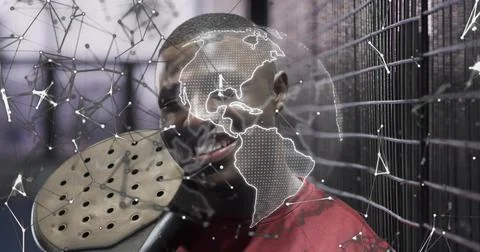 Holding round perforated device, man wearing red shirt in studio with digital Stock Photos