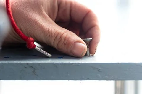 Holding a screw 写真素材