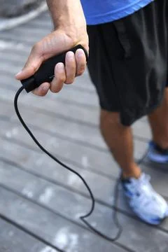 Holding a skipping rope preparing to skip rope Stock Photos